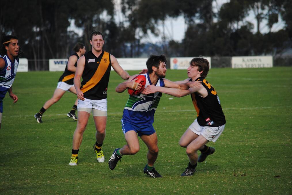 STIFF ARM: Kaniva-Leeor Cougar Alex Brown playing against the Mundulla Tigers in 2016. Brown scored one goal in the sides round one loss to Padthaway. Picture: FAIRFAX MEDIA