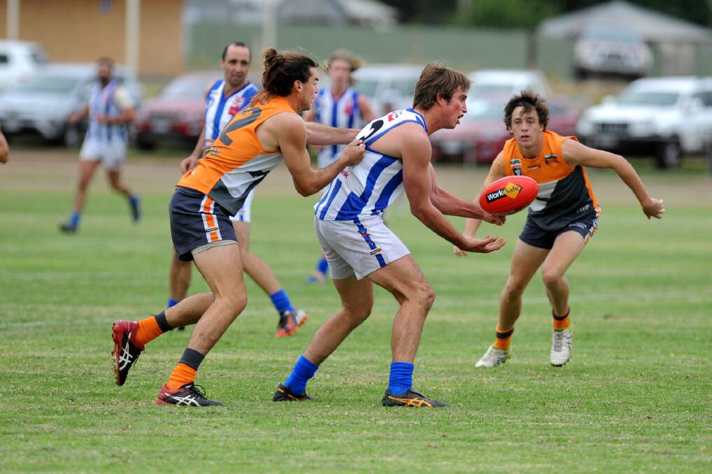 THE GRAND STAGE: Southern Mallee Giant elusive back man Sam Weddell tackles Harrow-Balmoral's Hamish Ellis. Picture: SAMANTHA CAMARRI