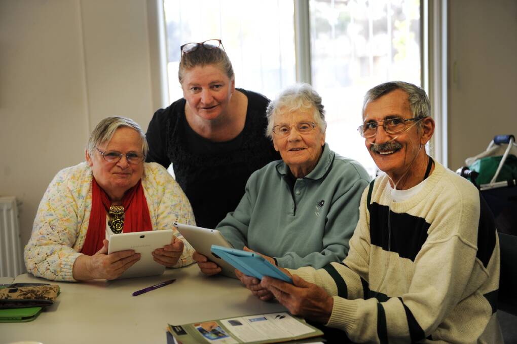 LEARN: Lorraine Fletcher, teacher Helen Dillon, Monie Forsyth and Pebbles Wentworth learn how to use tablets at Beulah Community Centre. Picture: PAUL CARRACHER
