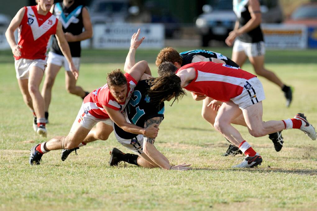 Laker Lachlan Marks makes a tackle on Ryan Folkes of Swifts. Picture: Olivia Page