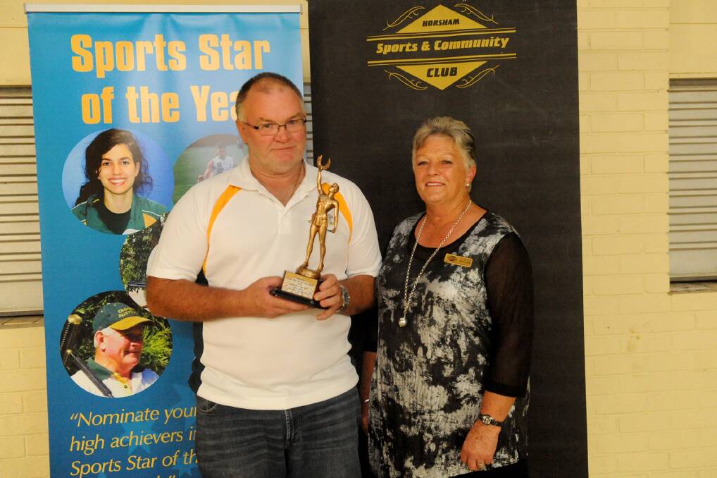 2015 Sports Star of the Year winner Craig Kelly, with Elaine Breuer at last year's ceremony. Pictures: SAMANTHA CAMARRI