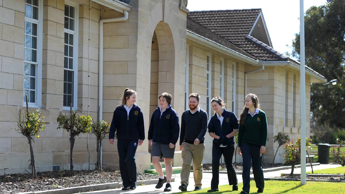 Warracknabeal Secondary College principal Michael Briggs-Miller with students
Prani May, Harry Butcher, Astra Macumber and Sarah Hadzig take a walk around the school in 2015. Picture: SAMANTHA CAMARRI