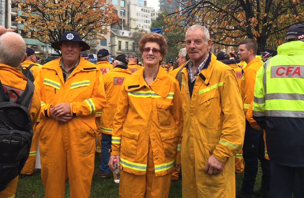 Country Fire Authority district 17 representatives John Robinson, Maree Varley and RObert Kelm at a rally in Melbourne on Sunday. Picture: MAURICE RUDOLPH