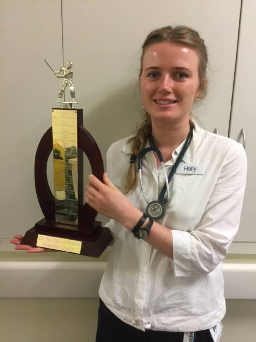 Dr Holly Blunt-Foley with the perpetual player of the match award for an annual cricket match between junior and senior doctors in Horsham.
