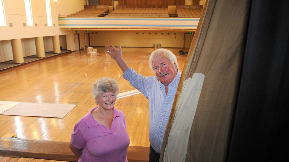 Kath Dumesny and Neville McIntyre in the old town hall, with the balcony seats in the background. Picture: PAUL CARRACHER