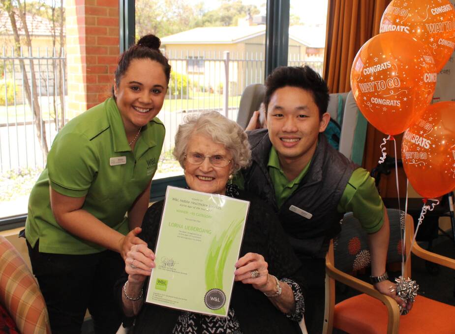 Lorna Uebergang receives the Active Ager of the Year award from the W&L Mobile Healthcare Services staff Britany and Chris at Dimboola Nursing Home. Picture: CONTRIBUTED