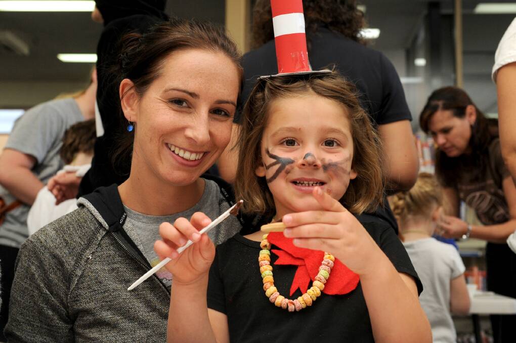 Kristy Kelly and daughter Charlotte, 4, of Horsham enjoy a Dr Seuss workshop at Horsham Library during the autumn school holidays. Picture: OLIVIA PAGE