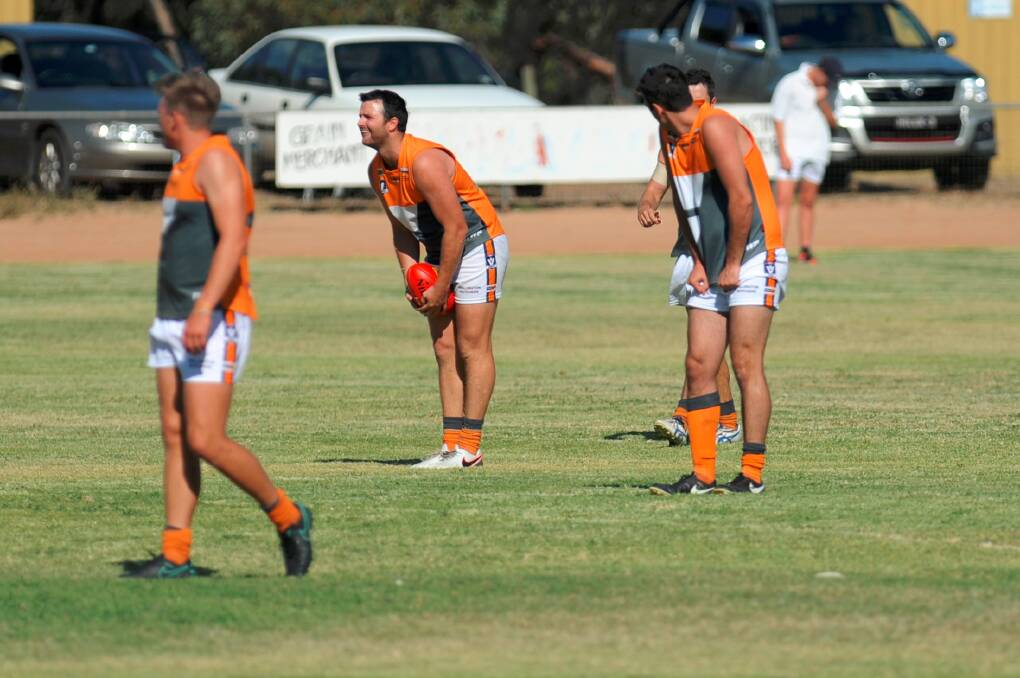 Kain Robins, middle, kicked 17 goals for the Giants on Saturday.