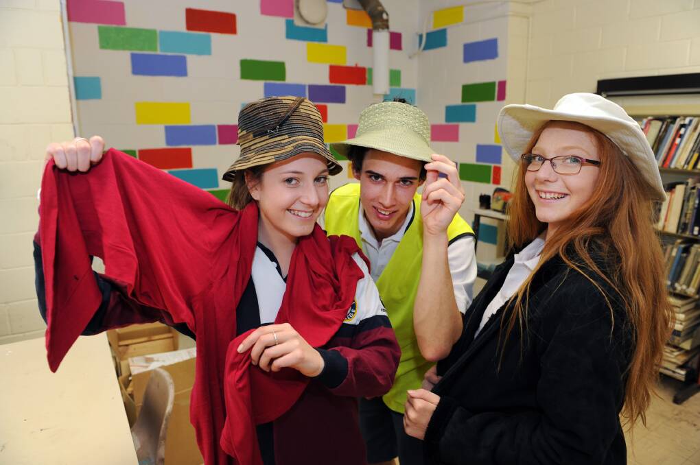 Horsham College students Rebecca Roy, Lachy Mills and Brianna Starick prepare for their social. Picture: PAUL CARRACHER