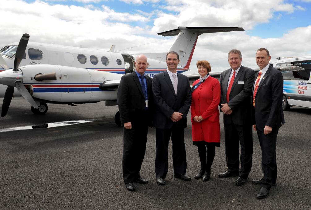 Royal Flying Doctor Service Victorian chief executive Scott Chapman, left, in the Wimmera in 2013. Picture: SAMANTHA CAMARRI