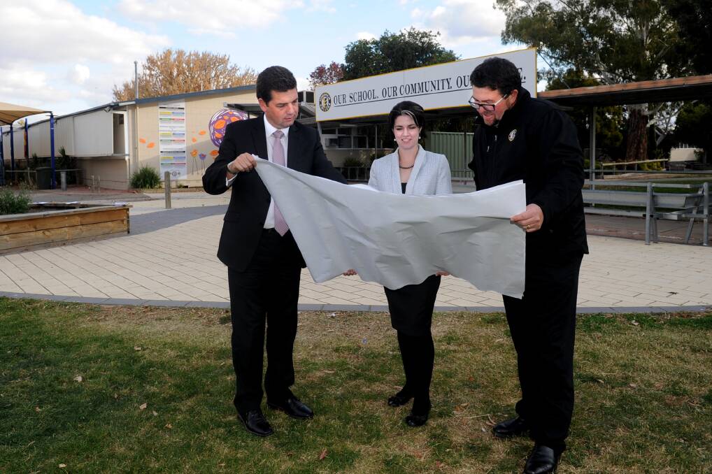 Shadow Education Minister Nick Wakeling, Member for Lowan Emma Kealy and Horsham College principal Rob Pyers look at the plans for the school's redevelopment in May last year. Picture: SAMANTHA CAMARRI
