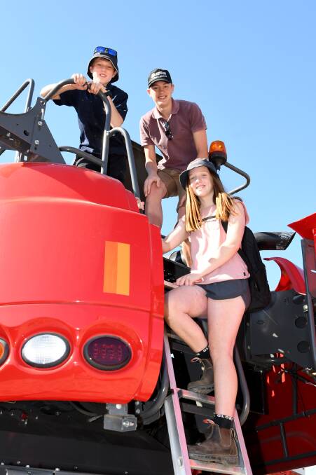 Holy Trinity Lutheran College students Thomas Bolwell, Nathan Rokebrand and Cassie Hateley at the Wimmera Machinery Field Days. Picture: SAMANTHA CAMARRI
