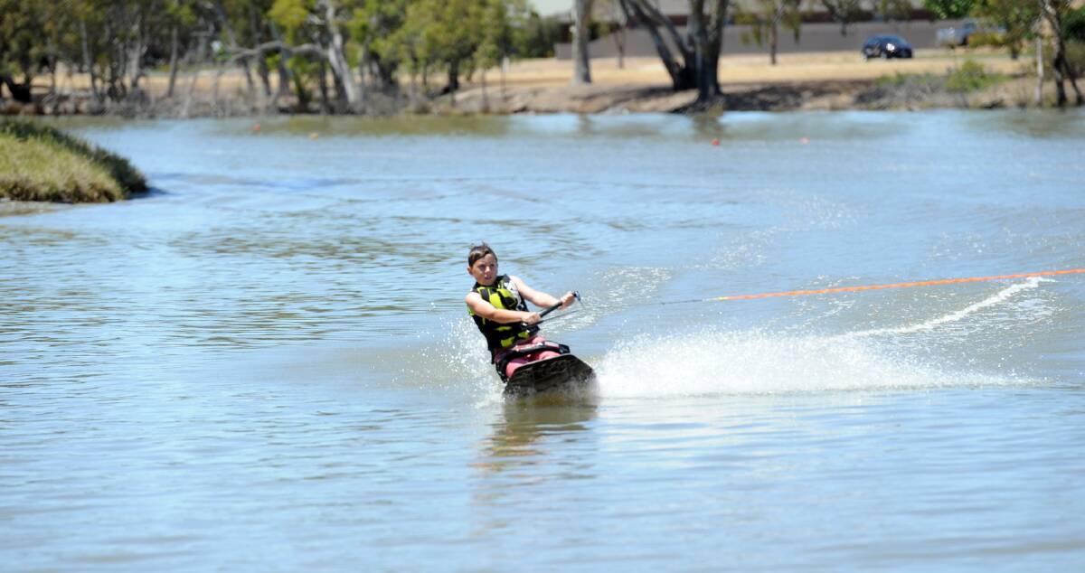 Seth Chequer kneeboards on the Wimmera River at the weekend as part of a ski trial, which will continue this week. Picture: PAUL CARRACHER