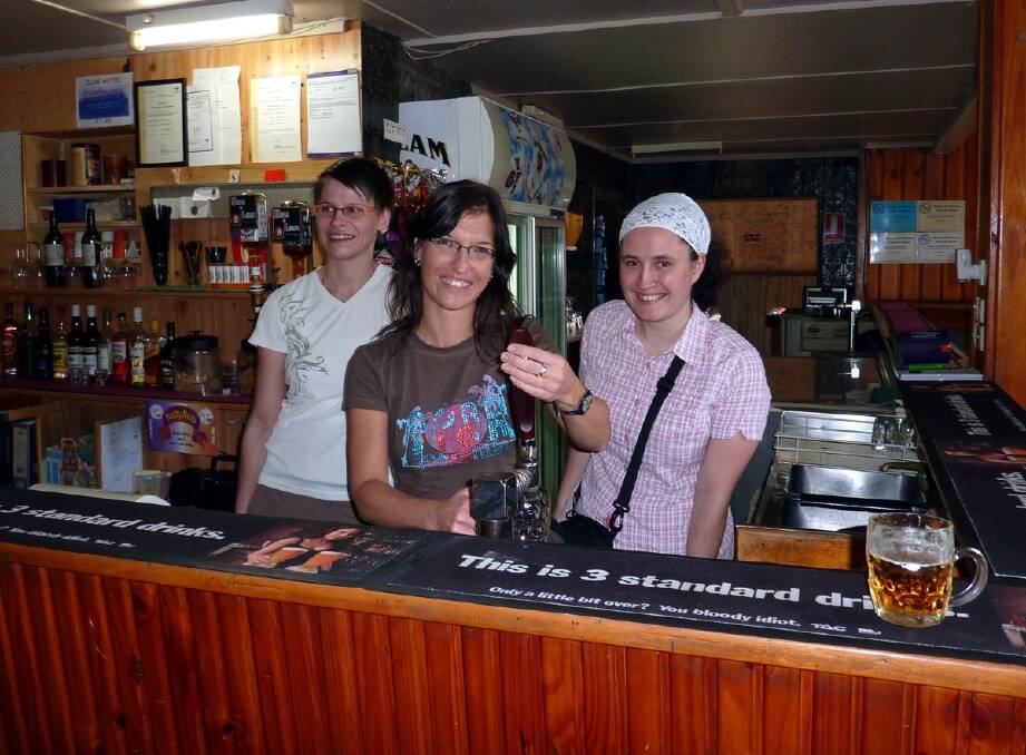Germany's Sylvia Wols pulls a beer in Minyip.