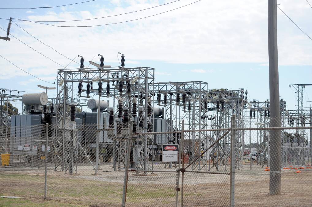 Powercor workers assess the Horsham power sub-station on Thursday morning. Picture: SAMANTHA CAMARRI