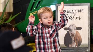 Billy Schier, 3, Horsham, gets into the groove of George the Farmer at the Wimmera Machinery Field Days. 