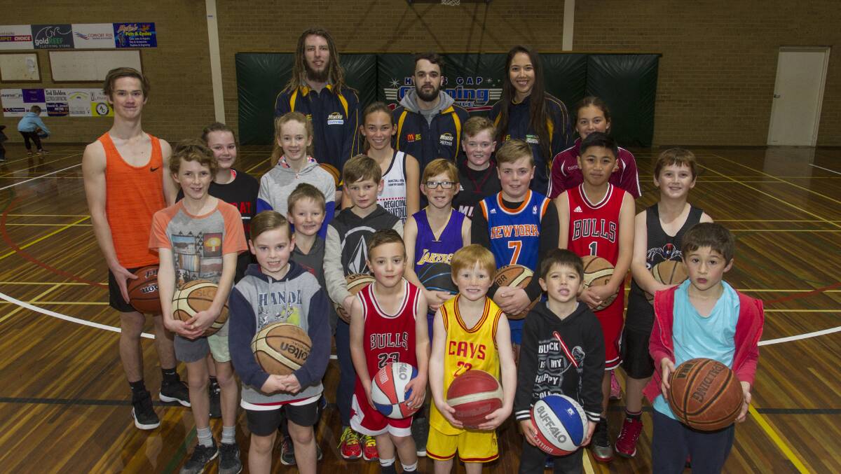 ALL SMILES: Ballarat Miners players Craig Moller and Peter Hooley and Ballarat Rush 2016 MVP Joy Burke at the Stawell Leisure Centre hosting a basketball clinic. The players boast a spread of domestic and international basketball experience between them. Picture: Peter Pickering. 