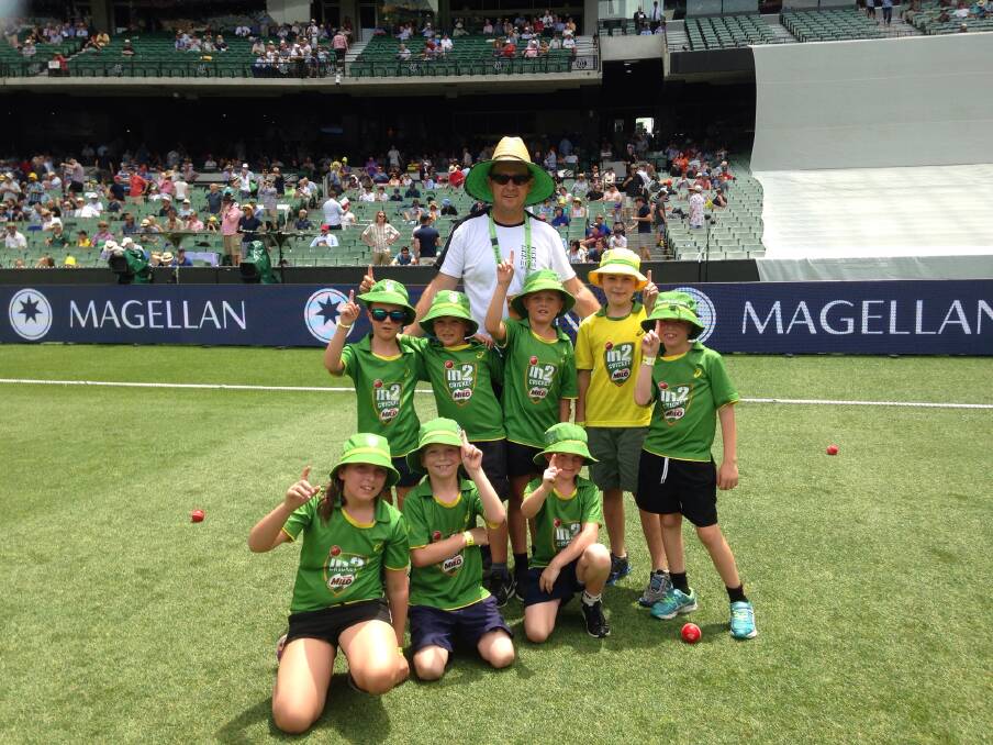 PRICELESS: Swifts-Great Western junior cricketers with Milo In2Cricket coordinator Travis Nicholson in the middle of the MCG at lunch on day three of the Boxing Day test.