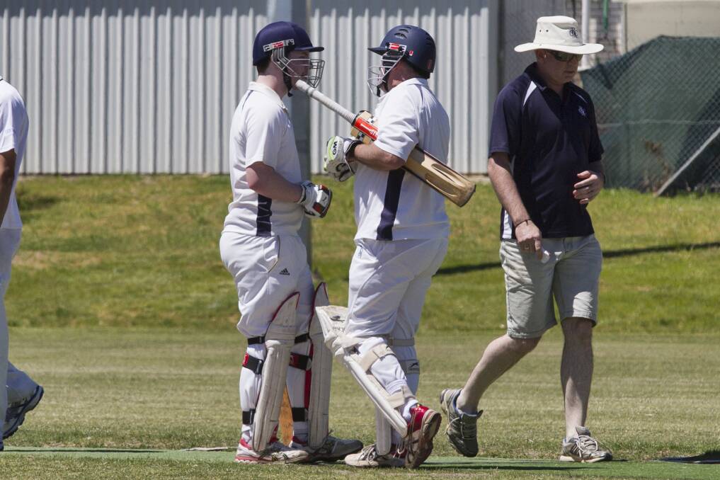 SPECIAL OCCASION: Father and son Nathan and Trevor Quick batted together when Nathan brought up his maiden century. Picture: Peter Pickering. 