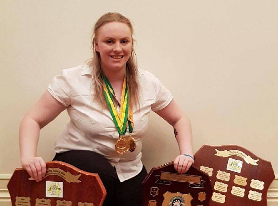 WINNING: Tori Kewish with her medals and shields from the Australian Darts Championship at Townsville. Picture: Contributed. 