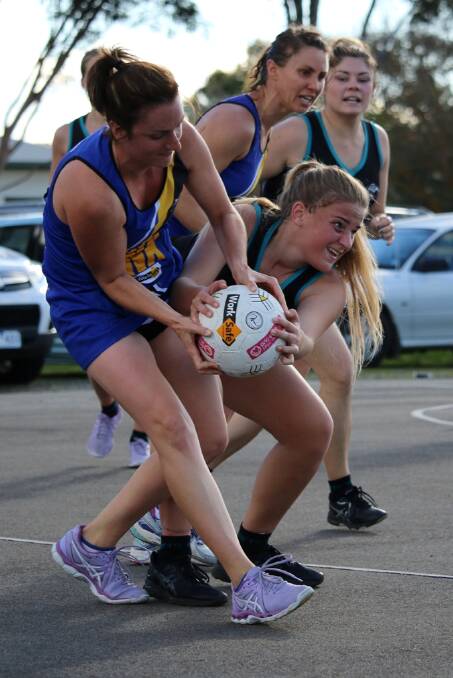 STRUGGLE: Swifts' Drew Smith fights for the ball against Natimuk United. 