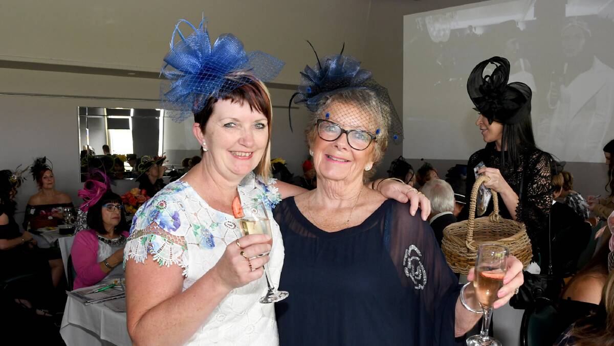 Allison Roberts and Susie Williams, both of Horsham, at last week's Melbourne Cup day lunch for Quota International Wimmera and Friends of the Hospital Foundation.