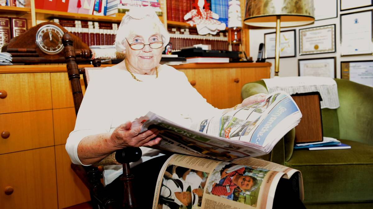 STAYING INFORMED: Horsham's Jo Johns has been reading the Mail-Times for 51 years. She has a copy of a current paper, and the Mail-Times' Century of Smiles publication published in 2008, which featured her husband, the late Don Johns.