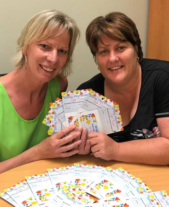 Business Horsham's Wendy Mitchell with Pauline Butler of Horsham District Kindergarten Association, who is providing staff with Shop Horsham gift cards for Christmas. Picture: CONTRIBUTED