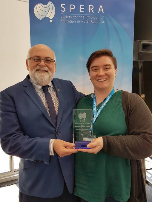 SUCCESS: Nhill College’s Melyssa Fuqua accepts the Australian Rural Education Award from SPERA president Brian O’Neill on behalf of the Western Victorian Careers Expo. Picture: CONTRIBUTED