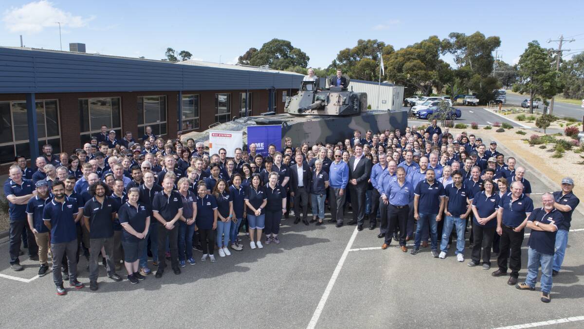 ARMOUR: AME Systems staff, Ripon MP Louise Staley and BAE Systems staff with the  AMV35 armoured vehcile. Picture: PETER PICKERING.