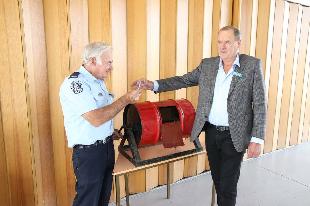 APPRECIATIVE: Appeal coordinator Reg Smith is impressed with the tally raised at this year, handed to him by Northern Grampians Shire Council mayor Tony Driscoll. 