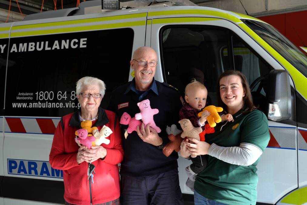 TRAUMA TEDDIES: Mary Frencham, Hannah and Tom Argall from CWA with Tim Maywald from Ambulance Victoria.