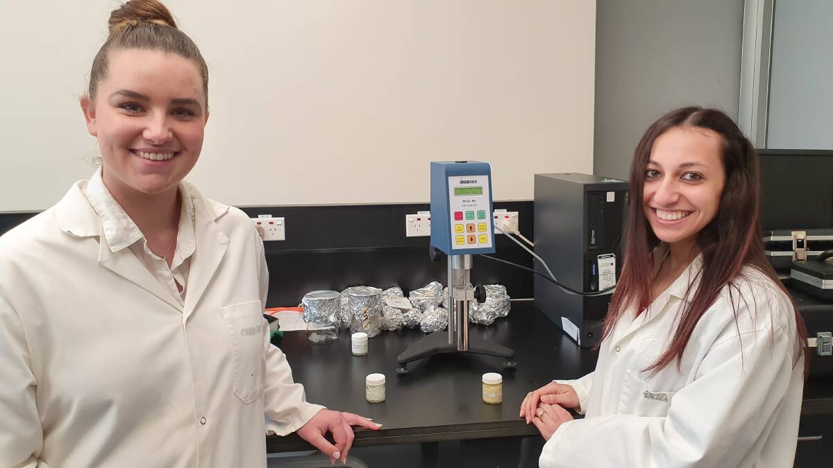 Charles Sturt University pharmacy students Mollie Gersbach and Haidy Ibrahim at work in the lab. Photo: supplied