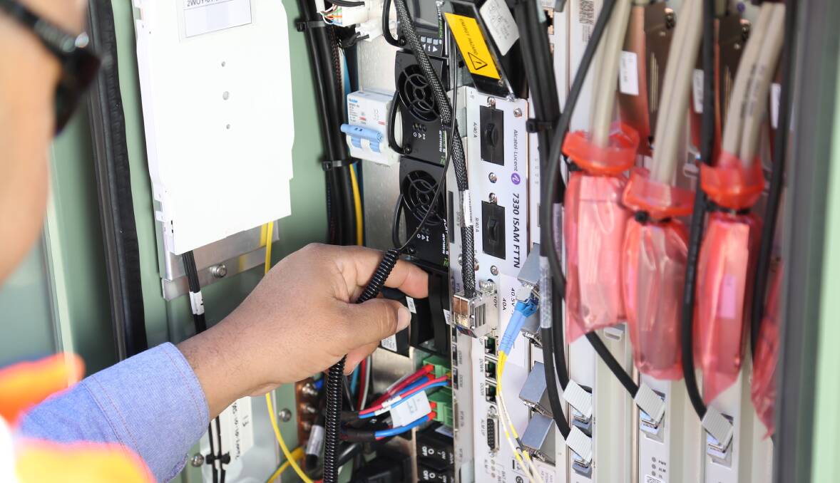 An NBN contractor installs fibre-to-the-node connections. Picture: CONTRIBUTED