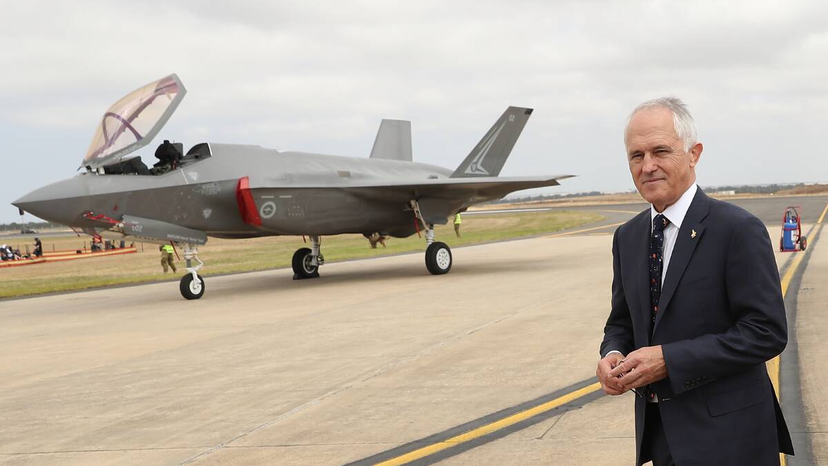 Prime Minister of Australia Malcolm Turnbull inspects a Joint Strike Fighter as he attends the Avalon Airshow on Friday. Picture: Scott Barbour/Getty Images