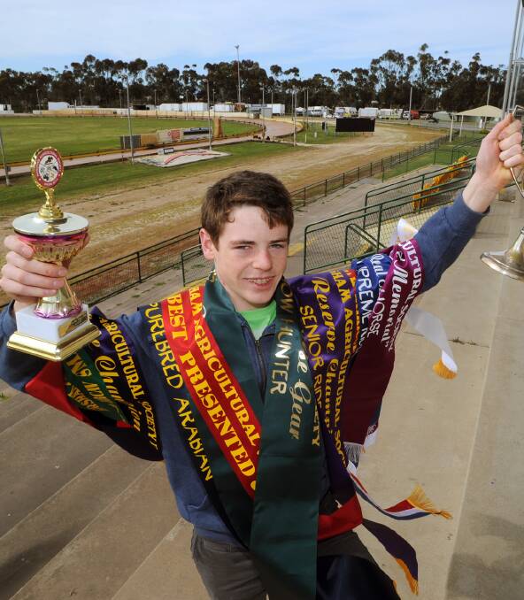 SHOWTIME: Horsham Pastoral and Agricutural Show committee member Matt Ough, 15, with ribbons and trophies on offer this year. Picture: PAUL CARRACHER