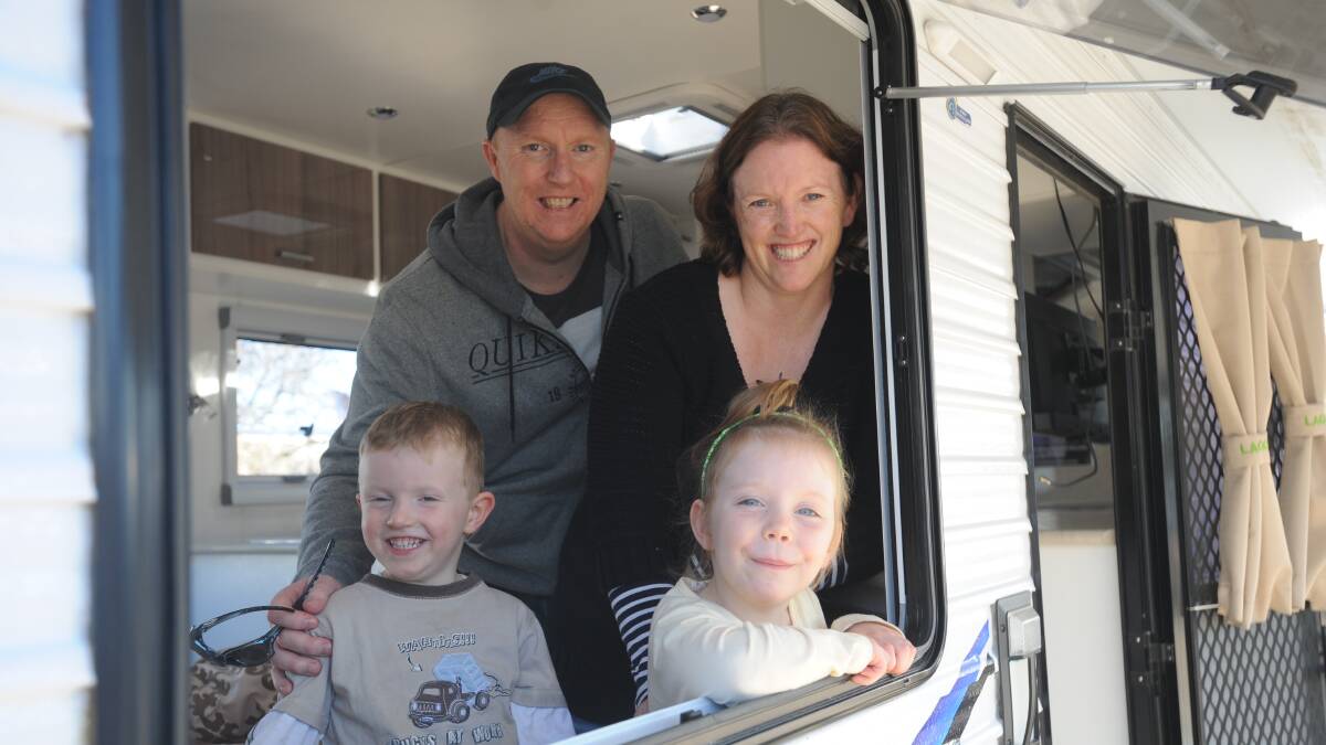 ROADSHOW: Horsham's Brendan and Deb Nitschke with Aiden, 3, and Sienna, 4, browse caravans during the Leisure Roadshow on Sunday.