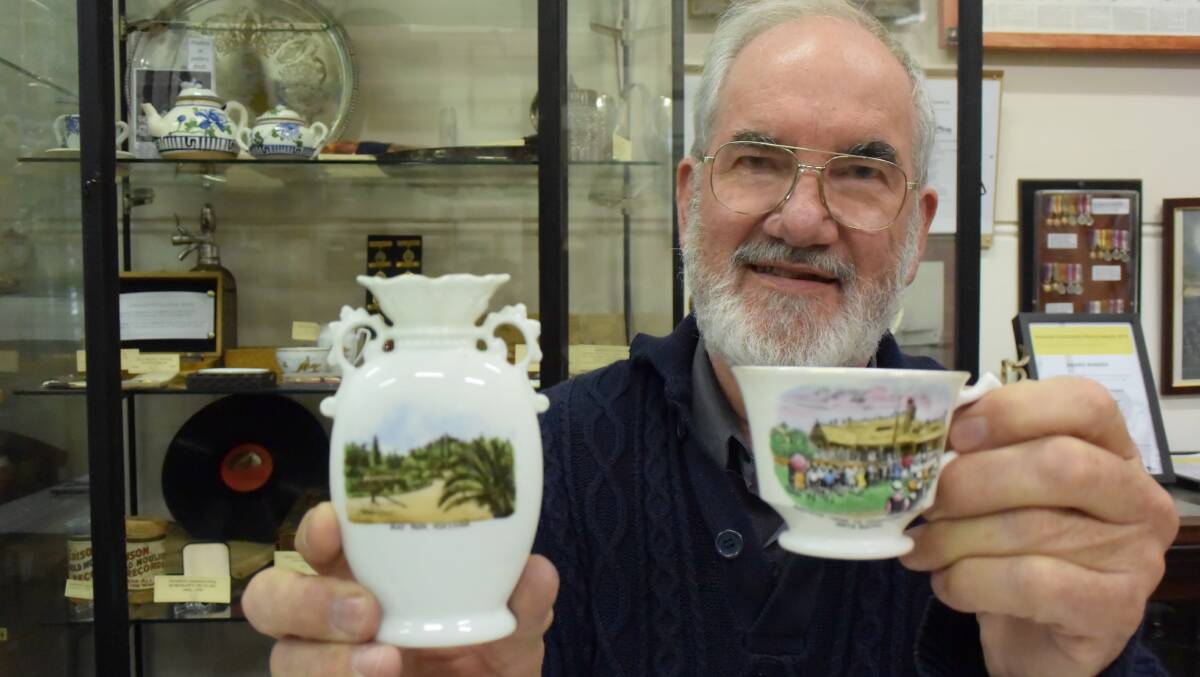 Horsham Historical Society president Rod Jenkinson with china pieces decorated with Horsham landmarks. The society marks its 60th year this week. Picture: REX MARTINICH