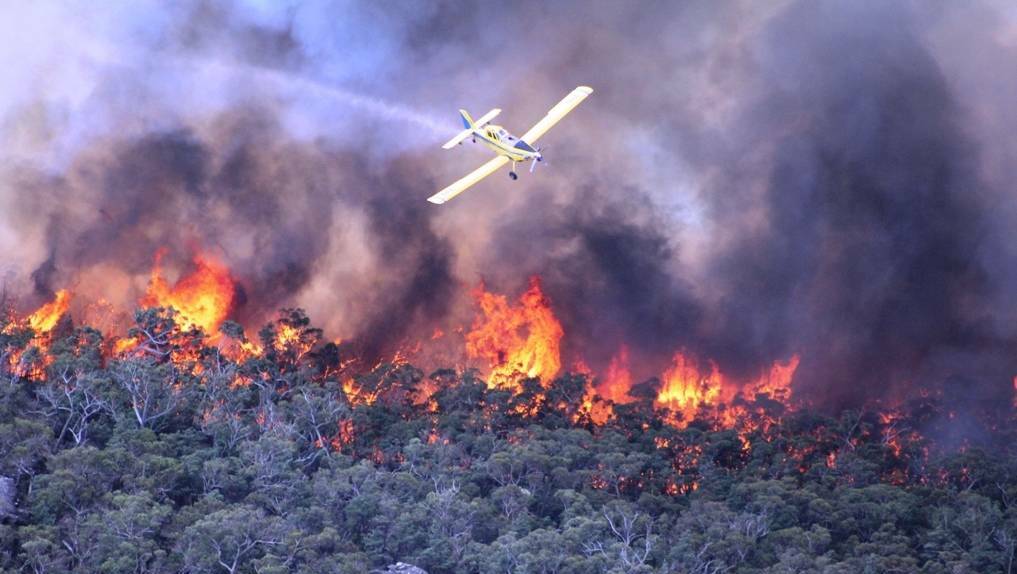 A water bombing aircraft responds to a bushfire in the Grampians in 2014. Picture:CFA