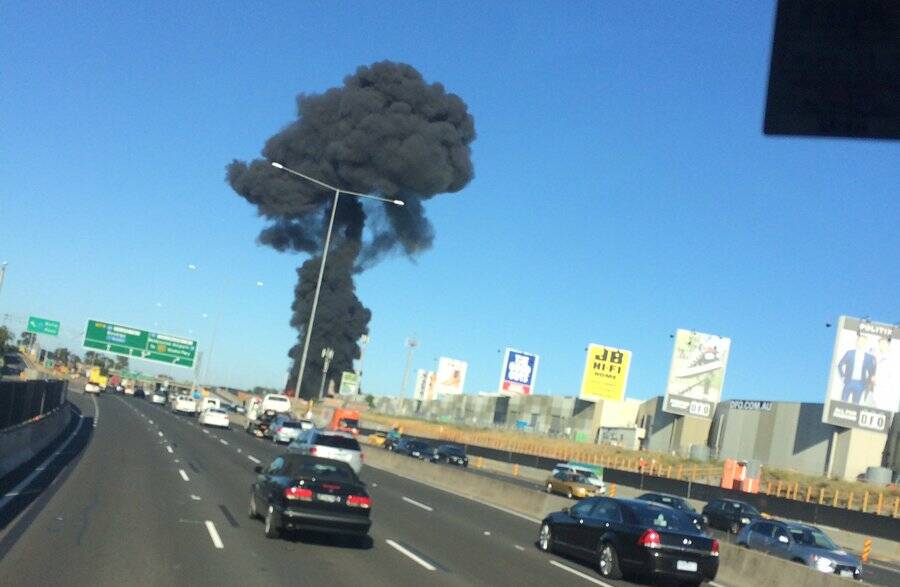 Smoke rises from a fatal passenger plane crash at Essendon Airport in February 2017. Photo: Twitter / @Tsm042
