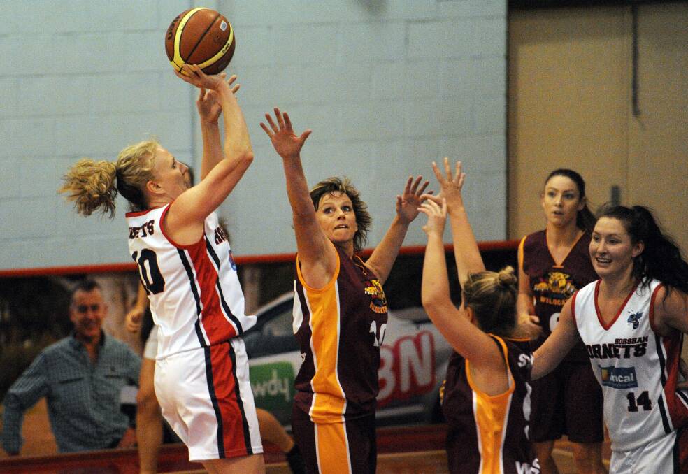 Sharon Fedke shoots over Tracey Dark in the Lady Hornets' match against Stawell last season. Picture: PAUL CARRACHER 