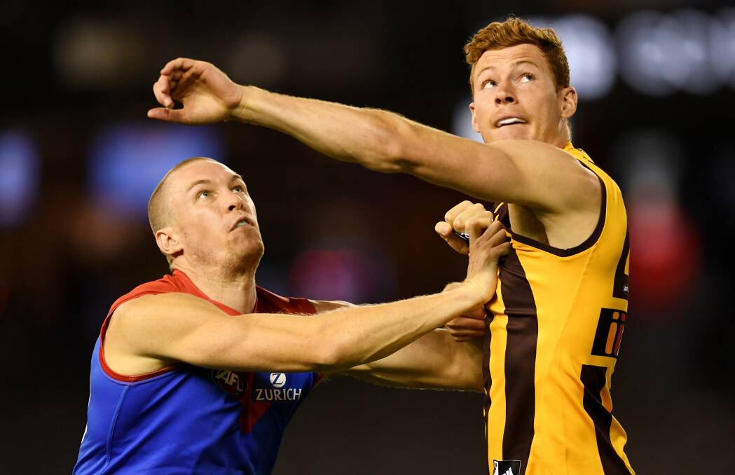 MUSCLE: Tom McDonald of the Demons and Tim O'Brien of the Hawks battle it out during the AFLX grand final last week. Picture: AAP