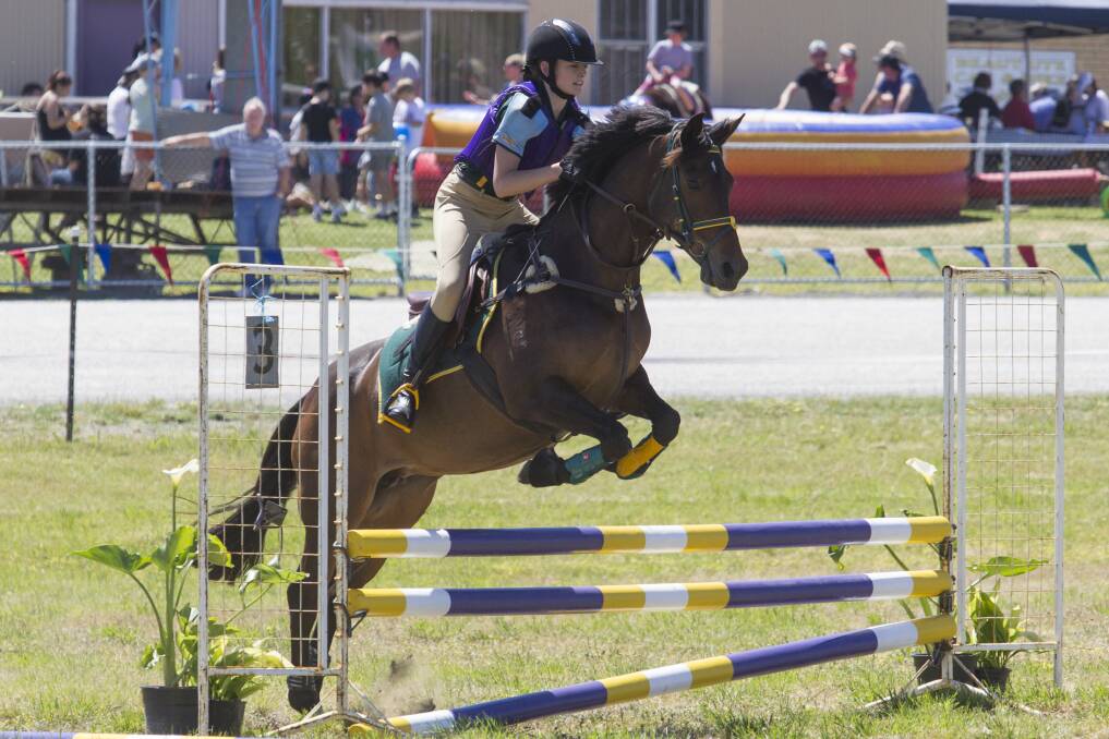 STATE CHALLENGE: Horsham's Morgan Lane takes her horse over a jump in October. She has qualified for a state competition and will compete alongside other Wimmera equestrians in the Yarra Valley next year.
