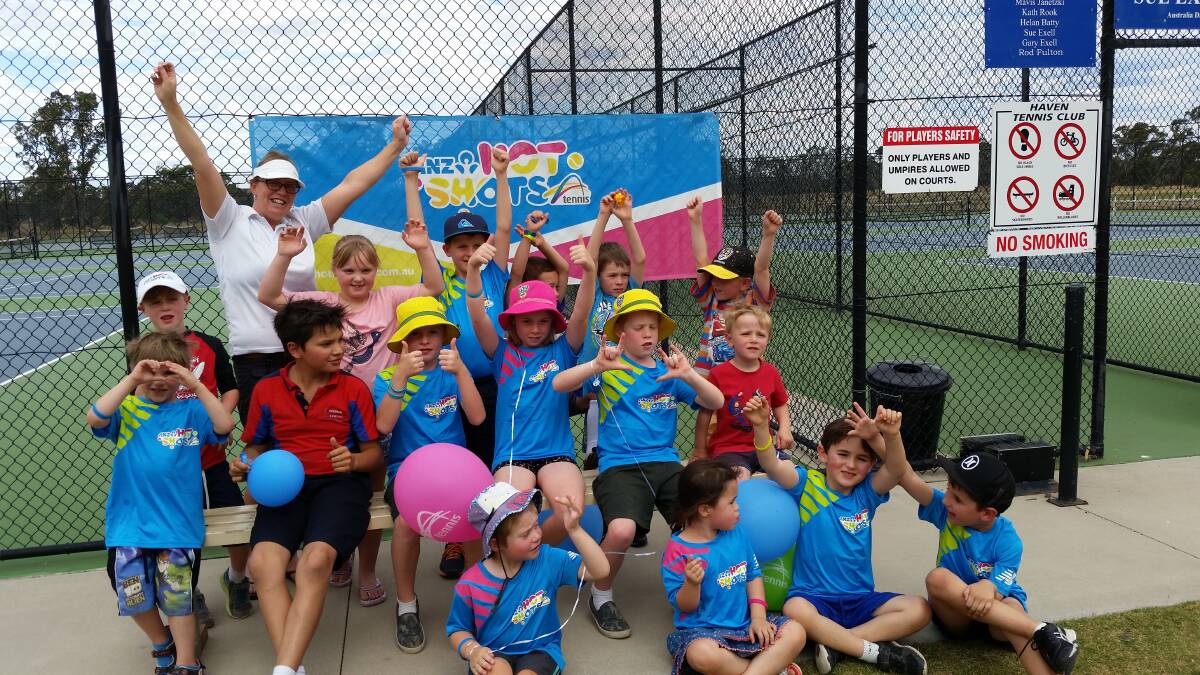 EXCITED: Haven Tennis Club secretary Rebecca Bird with an enthusiastic group of young tennis players. Picture: CONTRIBUTED