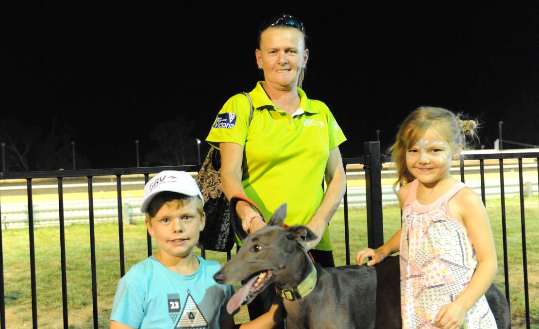 RETIRED: Greyhound Adoption Program volunteer Kerri Snoek with dog Lana and Darcy Rivett, 8, and Indee Leslie, 6. Picture: SEAN WALES