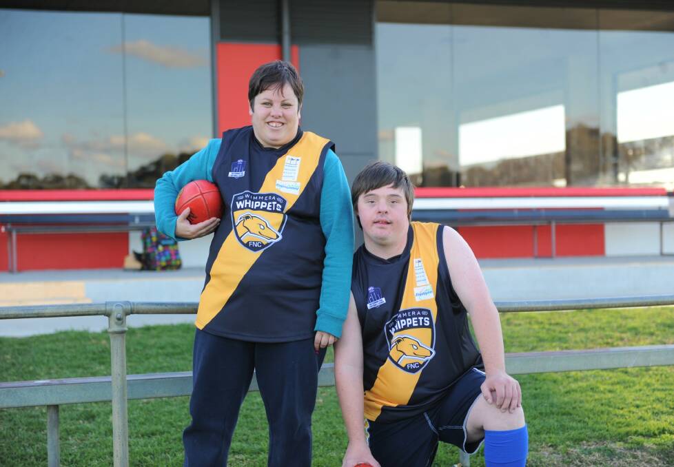 LOVING THE LOOK: Merryn Baxter and Lachie Young love the Wimmera Whippets' new playing jumpers. Picture: SEAN WALES