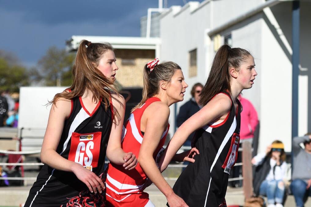 STEPPING UP: Maggie Caris and Lavinia Fox playing for the Horsham Saints in this year's A Grade elimination final. Fox is excited to play in the Victorian Netball League next season, but still hopes to come back and play for the Saints.