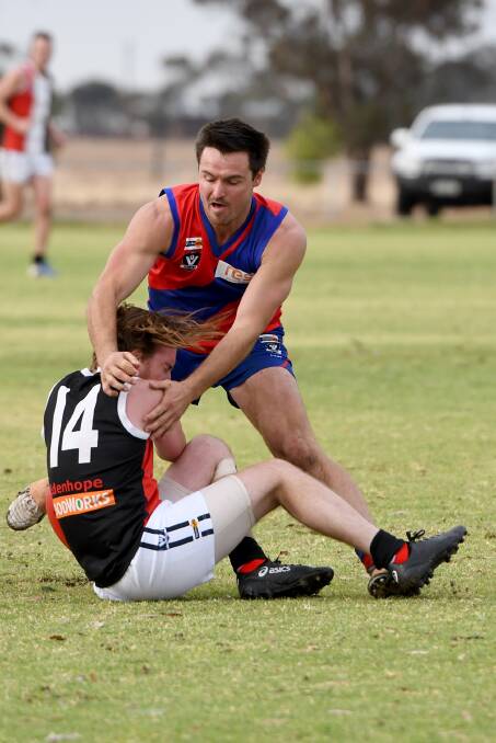 Kalkee's Daniel Launer tackles the Saints' Shayne Williams in round two.