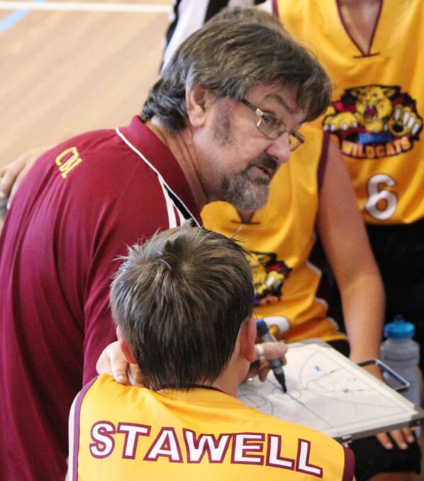 REWARD: Trevor Holmes, seen coaching a Stawell Wildcats junior team in the 2013-14 season, will carry the Queen's Baton in February.