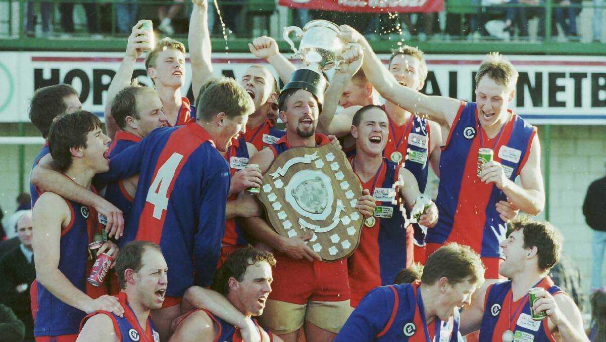 Rupanyup players celebrate after winning the 1998 premiership.